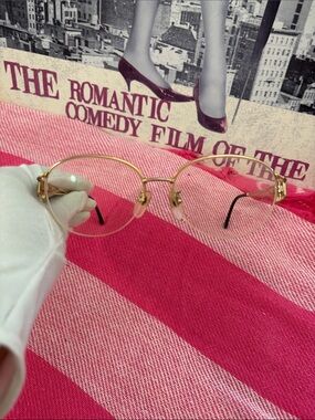 Yves Saint Laurent Gold Round Rimmed Women's Glasses with Black Temple Tips